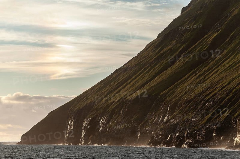 Steep green cliffs above the sea, sea spray, Vidareidi, Vidoy Island, Viðareiði, Viðoy Island, Faroe Islands, Denmark, Europe