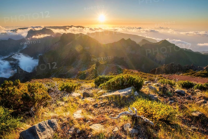 View of mountains over clouds from Pico Ruivo on sunset. Madeira island, Portugal, Europe