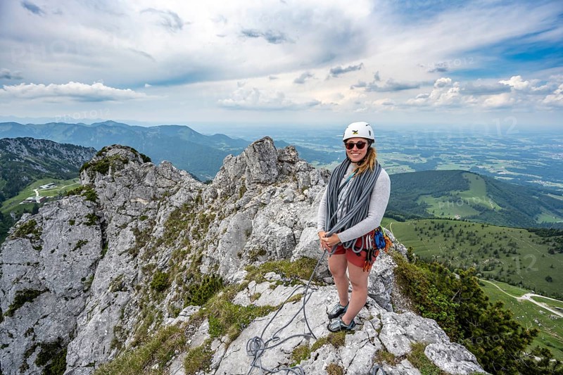 Climber with climbing rope on a climbing tour, climber on a mountain ridge, alpine climbing, crossing the Kampenwand, Chiemgau, Bavaria, Germany, Europe