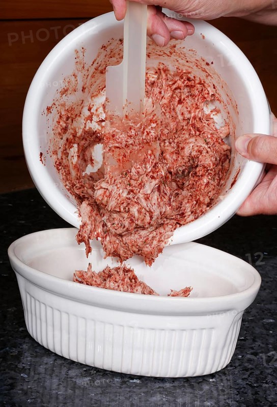 Swabian cuisine, preparation of Stuttgarter Leberkäs in a horseradish-mustard coating, making the meat mixture, fine meat mixture with pork liver, raw meat, offal, mixing bowl, Leberkäse, meat loaf, grandmother's kitchen, regional, home cooking, typical Swabian, men's hands, traditional cuisine, food photography, studio, Germany, Europe