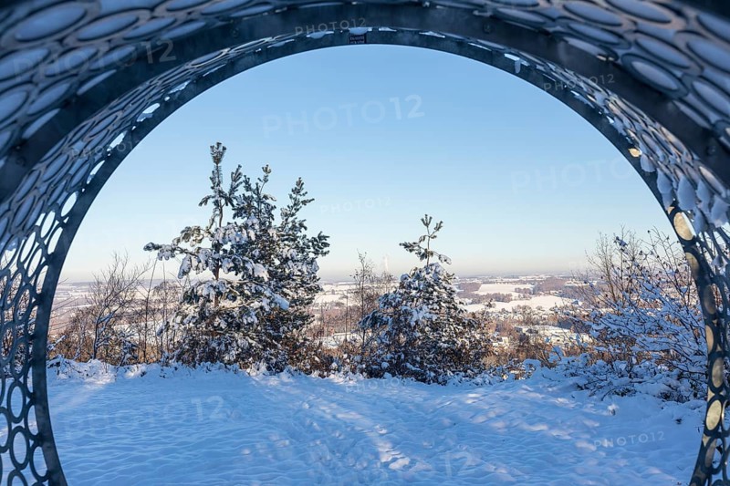View from the Wunderhorn art installation by Erika Harbort, metal tube with heated seat next to the Glückauf Tower, spoil tip from the former Deutschlandschacht mine in Oelsnitz in the Ore Mountains, Saxony, Germany, Europe