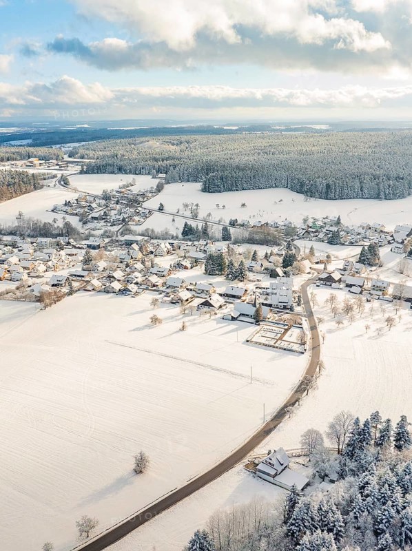 Snow-covered village with surrounding fields and hills in winter, Oberreichenbach, Black Forest, district of Calw, Germany, Europe
