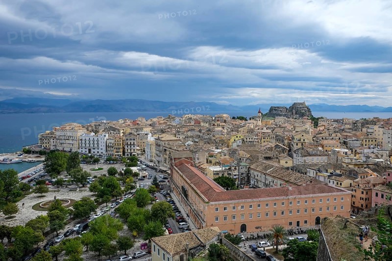 Corfu Town, Corfu, Greece, City overview Corfu Town with the Old Harbour, the Greek Orthodox Church of Agios Spiridon and the New Fortress. Behind mainland Albania, Europe