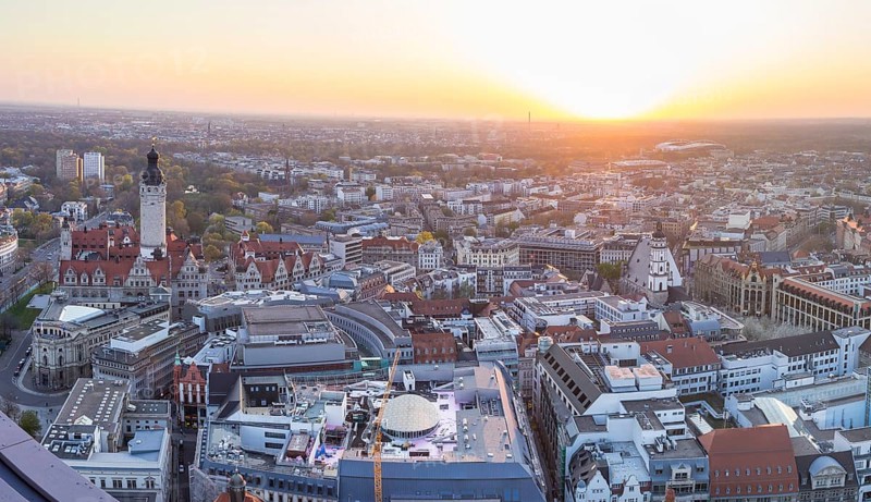 View of the city from the City Tower with evening sun, Neues Rathaus, Johannapark, Petersbogen and Thomaskirche, Leipzig, Saxony, Germany, Europe