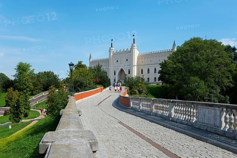 Path leads to a castle with towers and battlements, surrounded by trees and greenery, castle with museum, Lublin, Poland, Europe