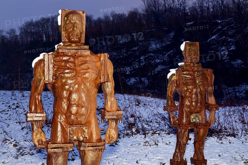 People made of iron, multi-part iron sculpture by Zbigniew Fraczkiewicz at the Henrichshütte in winter, Hattingen, Ruhr area, Germany, Europe
