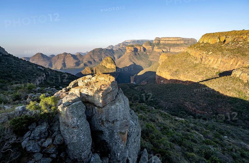 Sunset at Blyde River Canyon with Three Rondawels peak, view of canyon with Blyde River and Mesa mountains in the evening light, Upper Viewpoint, canyon landscape, Panorama Route, Mpumalanga, South Africa, Africa