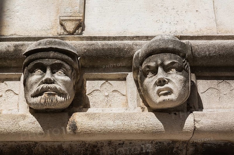 Sculpted faces and carved architectural details on outside wall of The Cathedral of Saint James, Sibenik, Croatia, Europe
