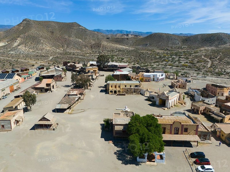 A western town with scattered trees and historic buildings in a dry, mountainous landscape, aerial view, Fort Bravo, western town, desert, Desierto de Tabernas, Tabernas, Almeria, Andalusia, Spain, Europe