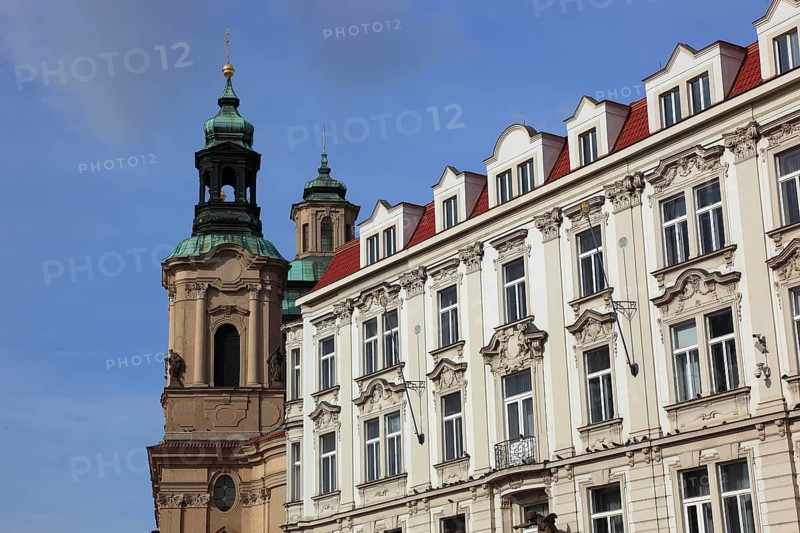 Historic houses and church tower of St Nicholas Church on Old Town Square, Prague, Czech Republic, Europe