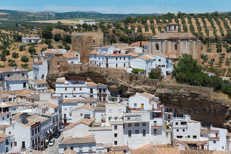 Historic buildings in a white village nestled in an impressive rock formation, cave dwellings, Setenil de las Bodegas, Cadiz, Andalusia, Spain, Europe