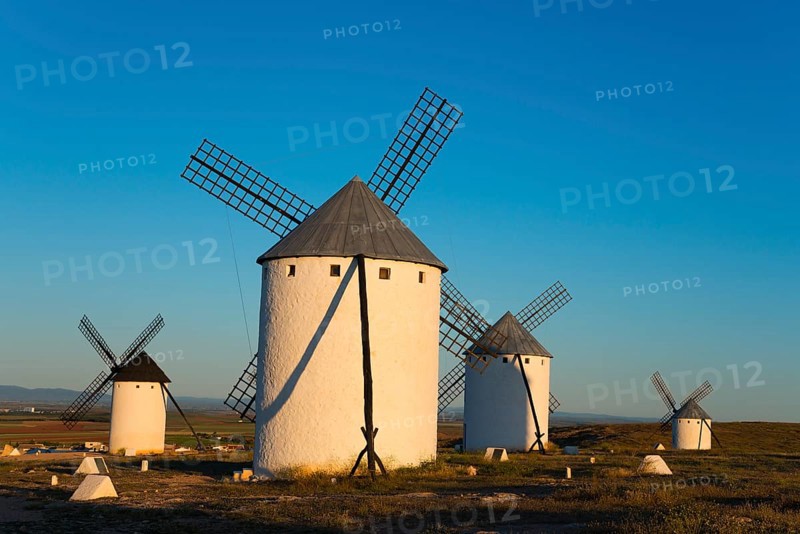 Four windmills in a sunny landscape panorama, Campo de Criptana, province of Ciudad Real, Castilla-La Mancha, Route of Don Quixote, Spain, Europe