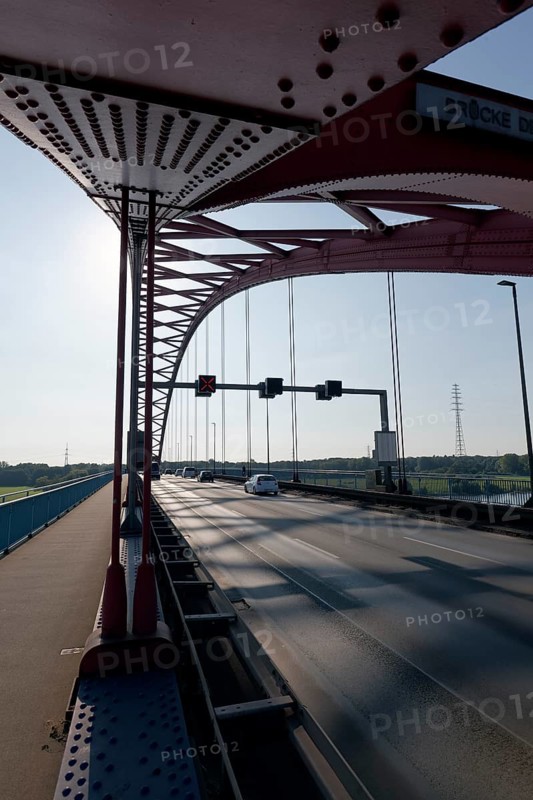Bridge of Solidarity against the light, road bridge between Rheinhausen and Duisburg-Hochfeld, arch bridge from 1934, Duisburg, North Rhine-Westphalia, Germany, Europe