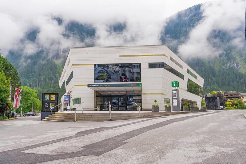 Modern building with large window front in foggy weather in the Alps, Mayrhofen, Zillertal, Austria, Europe