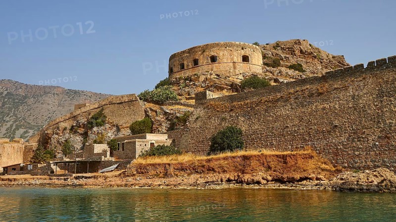 Ancient fortress with round tower on the coast, surrounded by water and rocks, Venetian sea fortress, Leper Island, Spinalonga, Elounda Bay, Mirabello Bay, East Crete, Crete, Greek Islands, Greece, Europe