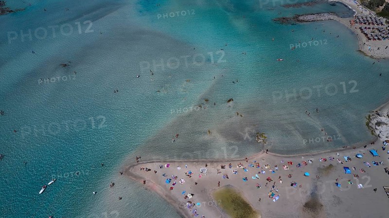 Overtourism, aerial view of a beach with many people and colourful umbrellas, surrounded by turquoise water, Elafonissi, lagoon, southwestern tip of Crete, Crete, Greek Islands, Greece, Europe
