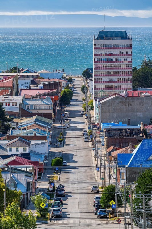 View from a hill over streets and houses to the Strait of Magellan, city of Punta Arenas, Patagonia, Chile, South America