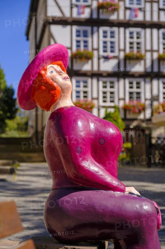 Sculpture, seated woman on the market square, Allendorf district, Bad Sooden-Allendorf, Werratal, Werra-Meißner district, Hesse, Germany, Europe
