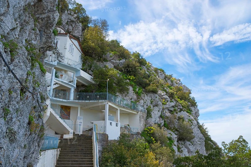 White building on a hillside with a stone staircase and surrounded by nature, rock church of Smerna, Church of the Assumption of the Virgin Mary, Panagia Smerniotissa, Elis, Peloponnese, Greece, Europe