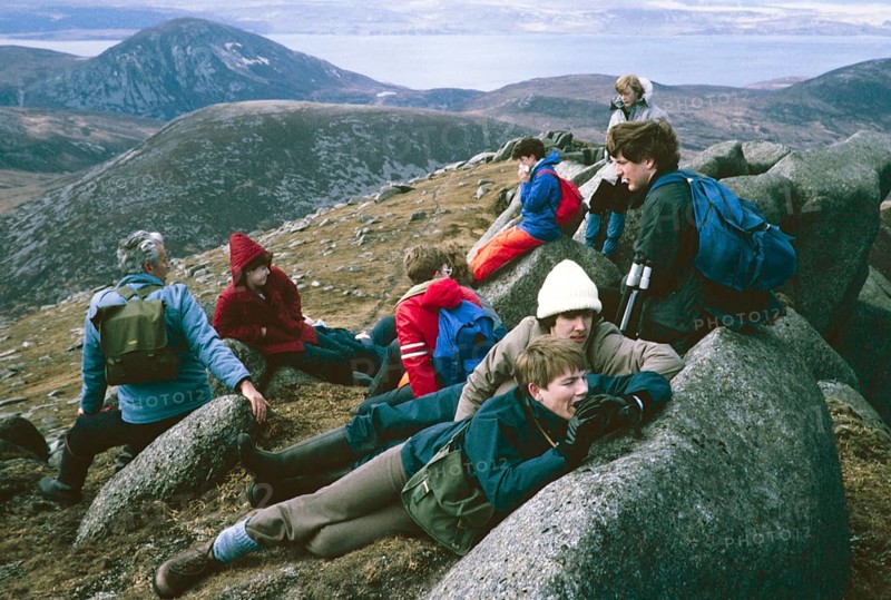 Lunch break for a group of boys during geographical fieldwork in the mountains of the Isle of Arran, Scotland, UK 1985