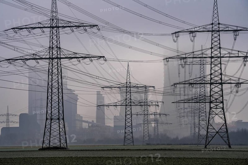 Large power line, 380 KV extra-high voltage lines, near Rommerskirchen, RWE lignite-fired power station Niederaußem in the fog, North Rhine-Westphalia, Germany, Europe