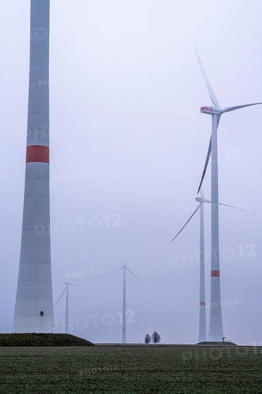 Wind farm in fog, dark doldrums, no wind no direct sunlight, in the Rhenish lignite mining area, south of the Garzweiler open-cast mine near Bedburg, North Rhine-Westphalia, Germany, Europe
