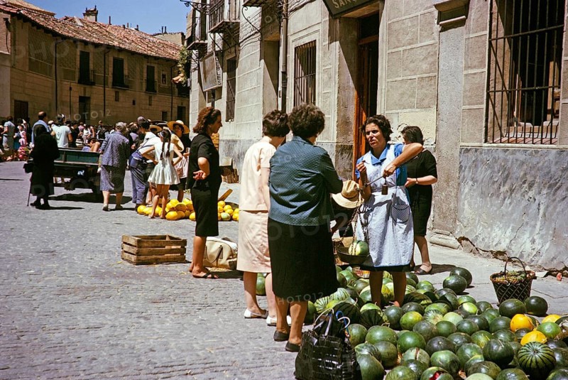 Selling watermelons and honeydew melons at the street market, Segovia, Castilla y León, Spain 1964