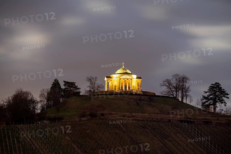 Burial chapel on the Württemberg on a hill at night with cloudy sky and trees in the background, illuminated, Stuttgart-Rotenberg, Baden-Württemberg, Germany, Europe