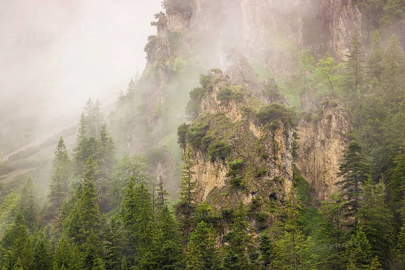 Wisps of mist cover the Karwendel mountains in the Großer Ahornboden nature reserve, Eng Valley, Tyrol, Austria, Europe