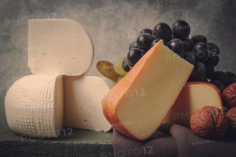 Georgian cheese, Imeretian and smoked suluguni, grapes, nuts, on a cutting board, Georgian cuisine, no people