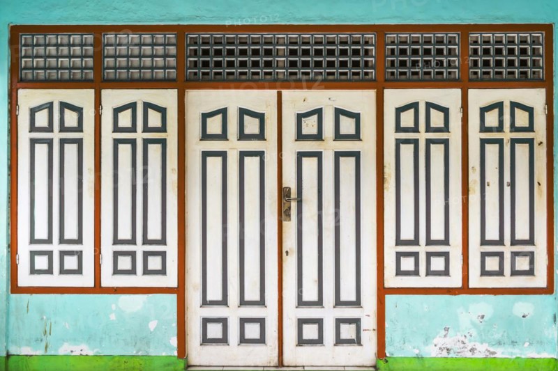 Closed, dilapidated building with peeled off house wall in turquoise colour, pastel, green, dilapidated, broken, abandoned, closed, crisis, background, texture, building, real estate, architecture, old, weathered, ancient, surface, renovation, in need of renovation, bankruptcy, hue, city, urban, cityscape, real estate crisis, exterior, economic crisis, peeled off, window, door, entrance, house wall, facade, Lombok, Indonesia, Asia