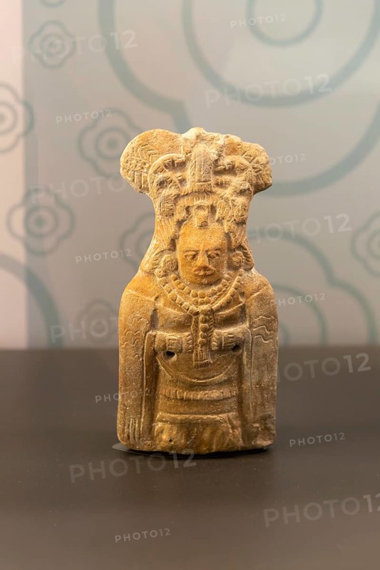 Ceramic figurine model of woman with mantle cloak, from Jaina, Late classical period, Mayan archaeological museum, Fort San Jose, Campeche, Mexico, Central America