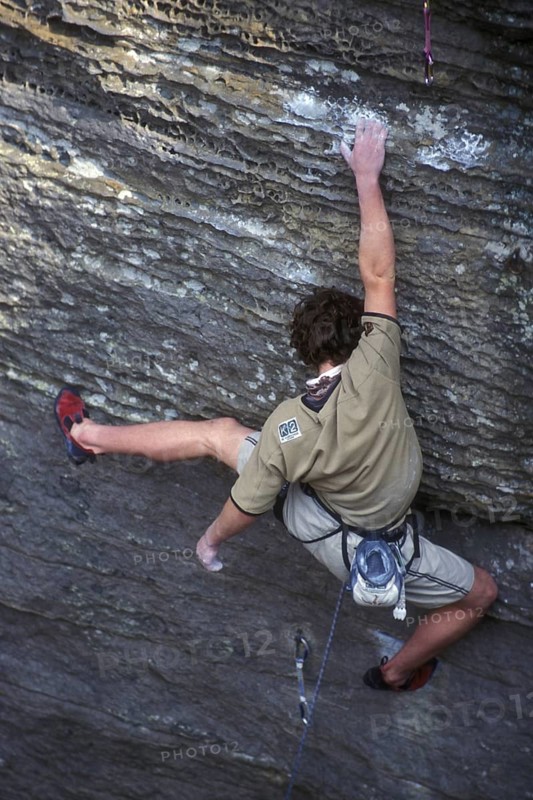 Rock climber climbing in sandstone cliff Wanterbaach, Berdorf, Little Switzerland / Mullerthal, Grand Duchy of Luxembourg