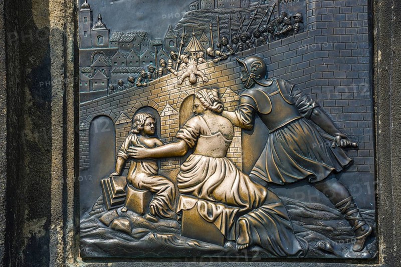 Bronze relief, Saint Nepomuk falling over the bridge, laying hands on the relief in the pillar is said to bring good luck, Charles Bridge, Prague, Bohemia, Czech Republic, Europe
