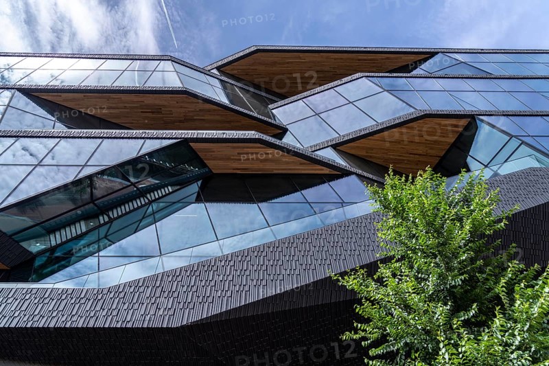 New corporate headquarters of Booking.com, online travel agency, hotel broker, building at Oosterdokseiland in the city centre of Amsterdam, Netherlands