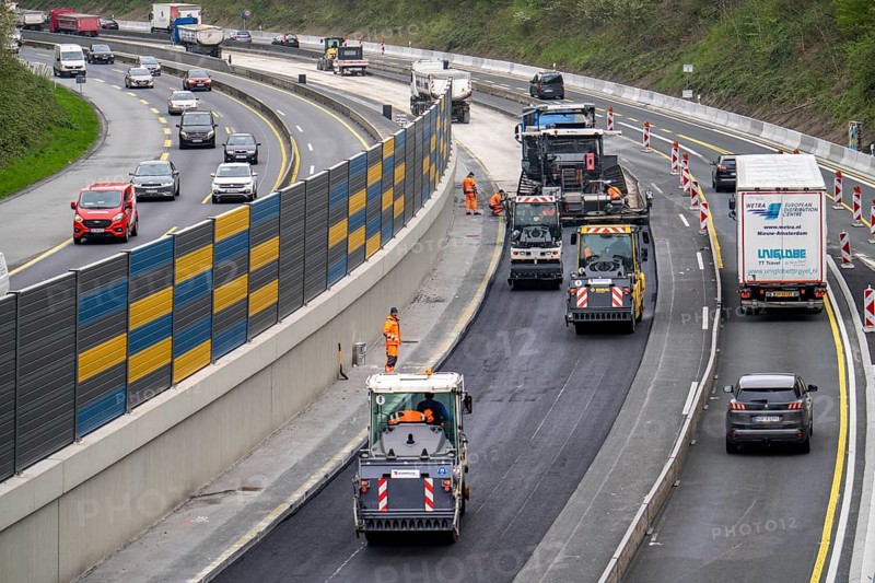 Motorway construction site on the A52 in Essen Basic refurbishment of the motorway, new noise barriers, sewerage system, new road surface, asphalting work, North Rhine-Westphalia, Germany, Europe