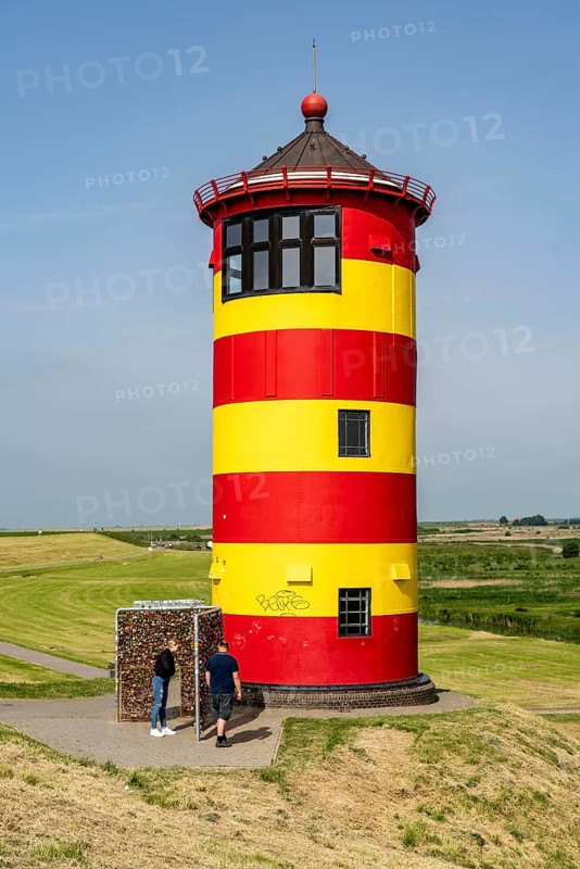 The Pilsum lighthouse on the North Sea dyke near Greetsiel, East Frisia, Lower Saxony, Germany, Europe