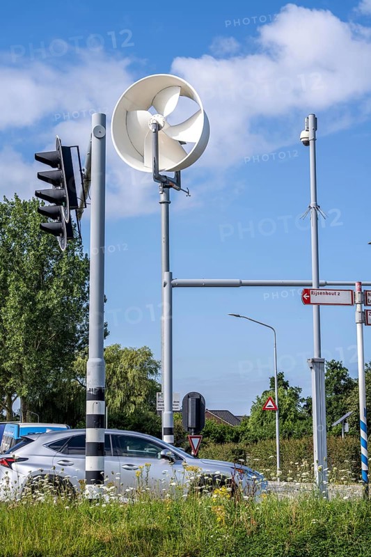 A mini wind power plant in the small Dutch town of Haarlemmermeer supplies the traffic lights at a road junction with electricity, test facility to test the effectiveness of such mini windmills to supply other areas, such as street lighting, with climate-neutral energy, Bennebroekerweg junction, Rijnlanderweg, Netherlands