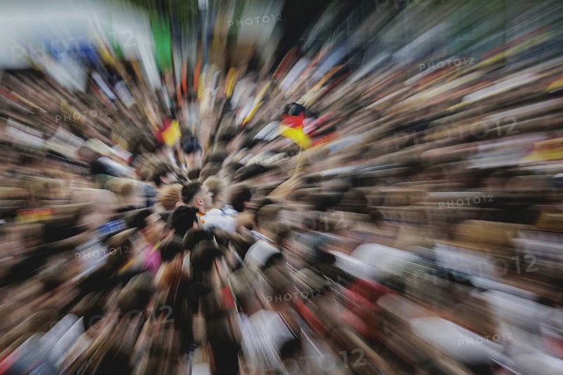 Fans react during the European Championship preliminary round match between Germany and Hungary on the fan mile in front of the Brandenburg Tor in Berlin, 19 June 2024