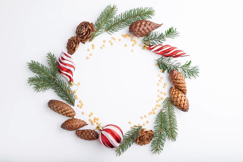 Christmas or New Year wreath composition. Decorations, balls, cones, fir and spruce branches, on white background. Top view, copy space, flat lay