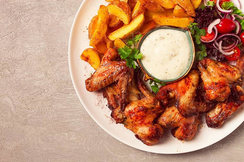 Fried chicken wings, with potatoes, and spices, homemade, fast food, no people