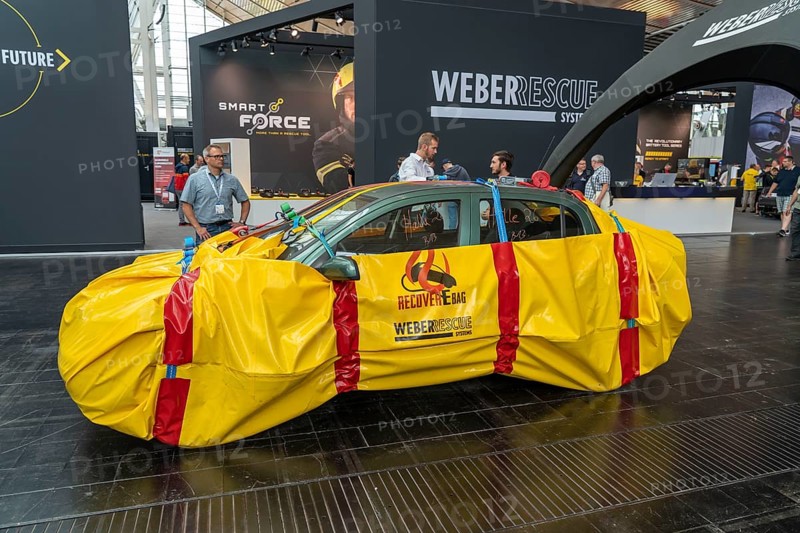 Interschutz 2022 trade fair in Hanover, the world's largest trade fair for fire, rescue and disaster control technology, equipment, over 1300 exhibitors from 50 countries, packaging of electric vehicles after a battery fire, in a fireproof cover for safe transport