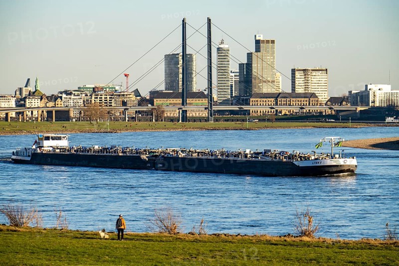 Düsseldorf, city centre skyline, skyscrapers, Rheinkniebrücke, Rhine, cargo ship