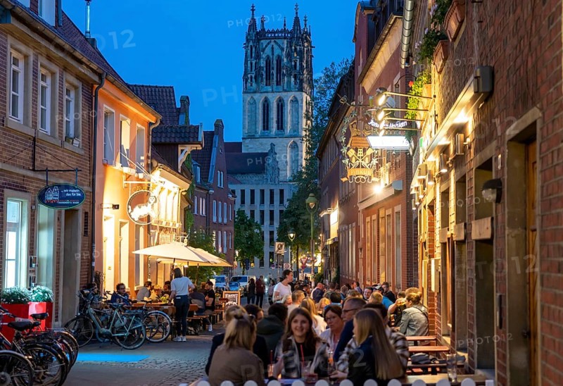 Historic old town, Kuhviertel, pub district, Kreuzstraße, tower of the Liebfrauen-Überwasserkirche, in Münster, North Rhine-Westphalia, Germany, Europe