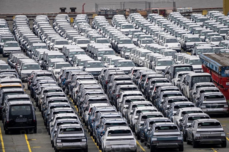 Parking space for import vehicles, hundreds of Hyundai Ioniq, electric cars, waiting for onward transport, at the EUROGATE container terminal in the overseas harbour of Bremerhaven, Lower Saxony, Germany, Europe