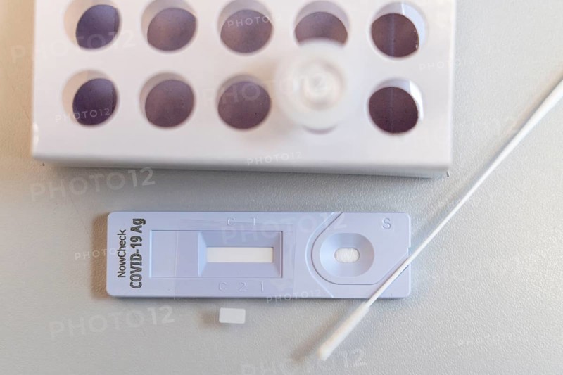 Covid-19 rapid test, antigen test, the abrasion of the swab is dissolved in a liquid and applied to the test device, after a few minutes the test device shows the result by a black line whether the person has tested positive or negative