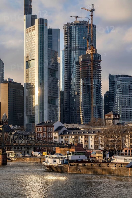 Skyline of the city centre of Frankfurt am Main, river Main, Eiserner Steg bridge, freighter, dusk, Hesse, Germany, Europe