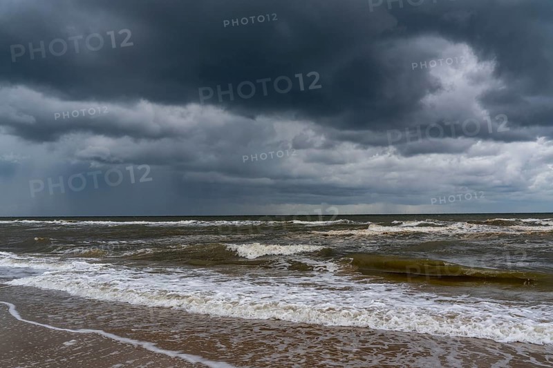 Beach, dark storm clouds, choppy sea, autumn on the North Sea in North Holland, between the towns of Egmond aan Zee and Bergen aan Zee, Netherlands