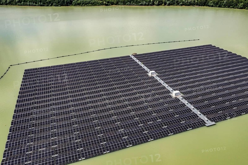 Germany's largest floating solar power plant on the Silbersee III, a quarry pond no longer used for sand mining, near Haltern am See, operated by Quarzwerke GmbH, around 5800 solar modules, on an area of a good 2 football pitches, generate 3.1 megawatts of power, the company uses the electricity itself on weekdays, at weekends it flows into the public grid, North Rhine-Westphalia, Germany, Europe