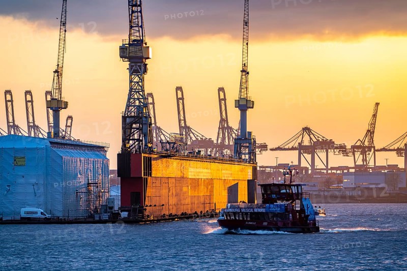 Port of Hamburg, view of the Blohm + Voss shipyard, Dock 11, evening, cranes of the container terminals, Hadag harbour ferry, Hamburg Germany